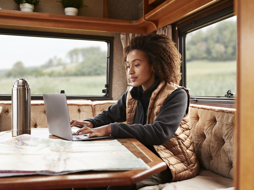 Woman Travelling With Her Laptop In An RV